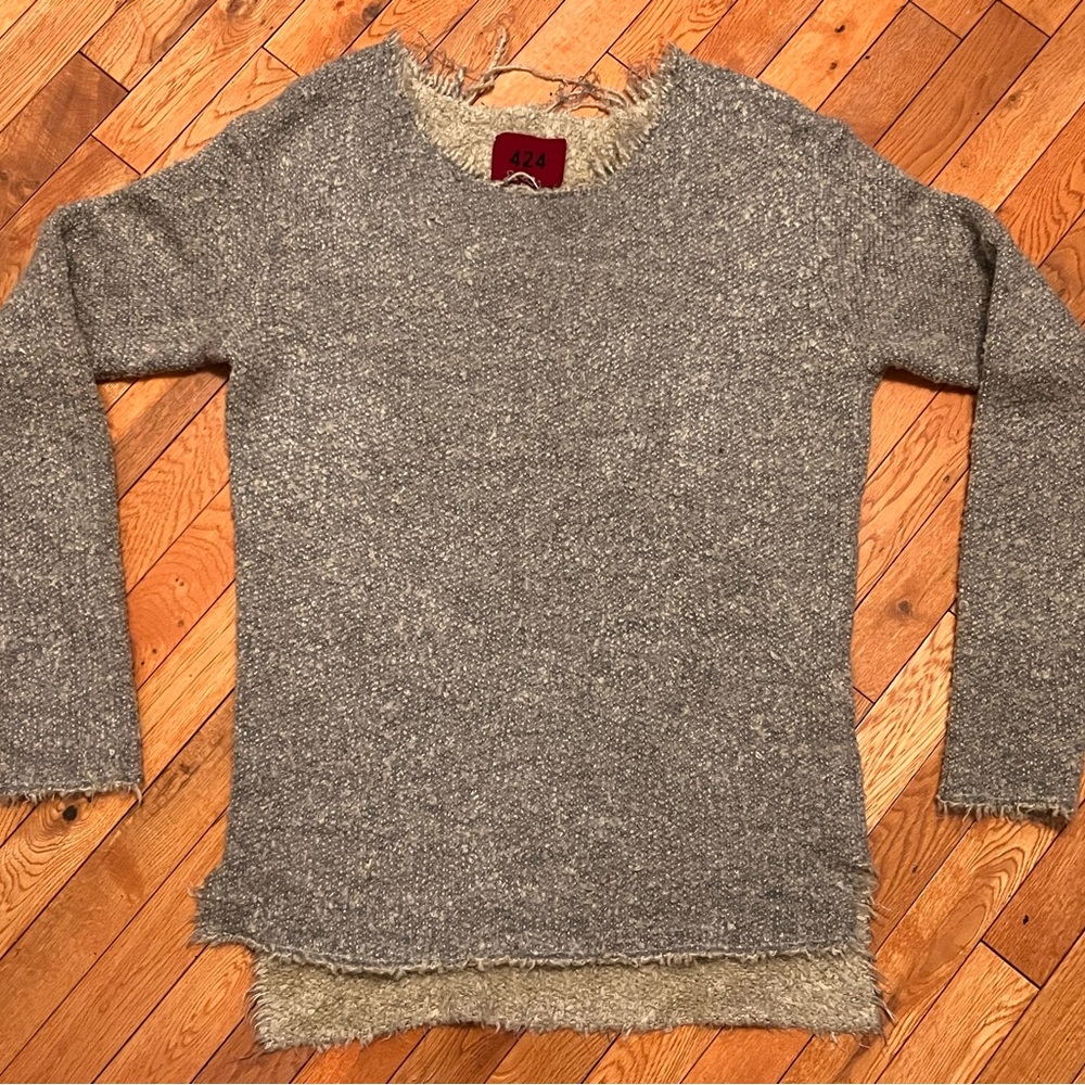 424 torn sweater